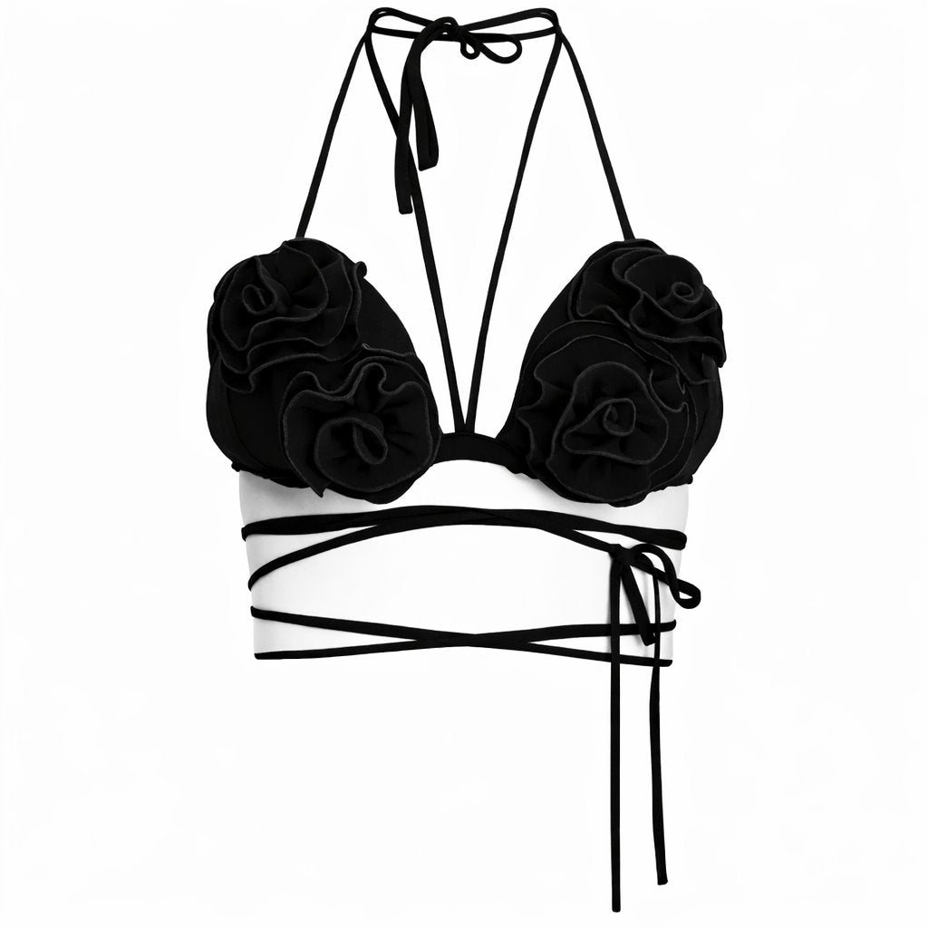 Black floral strap top on a white background